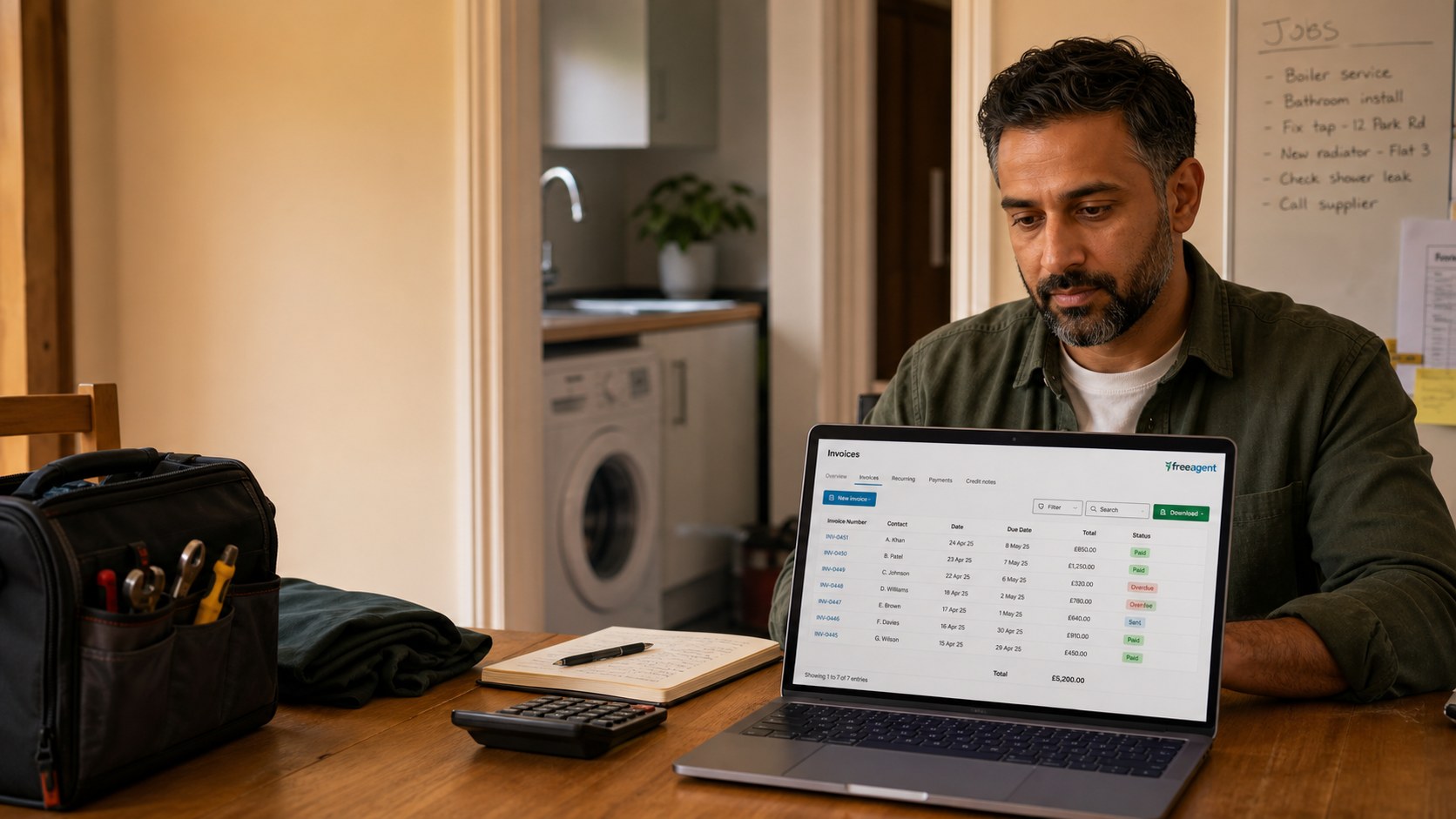 An owner-led plumbing business reviewing JobTek invoices in FreeAgent.