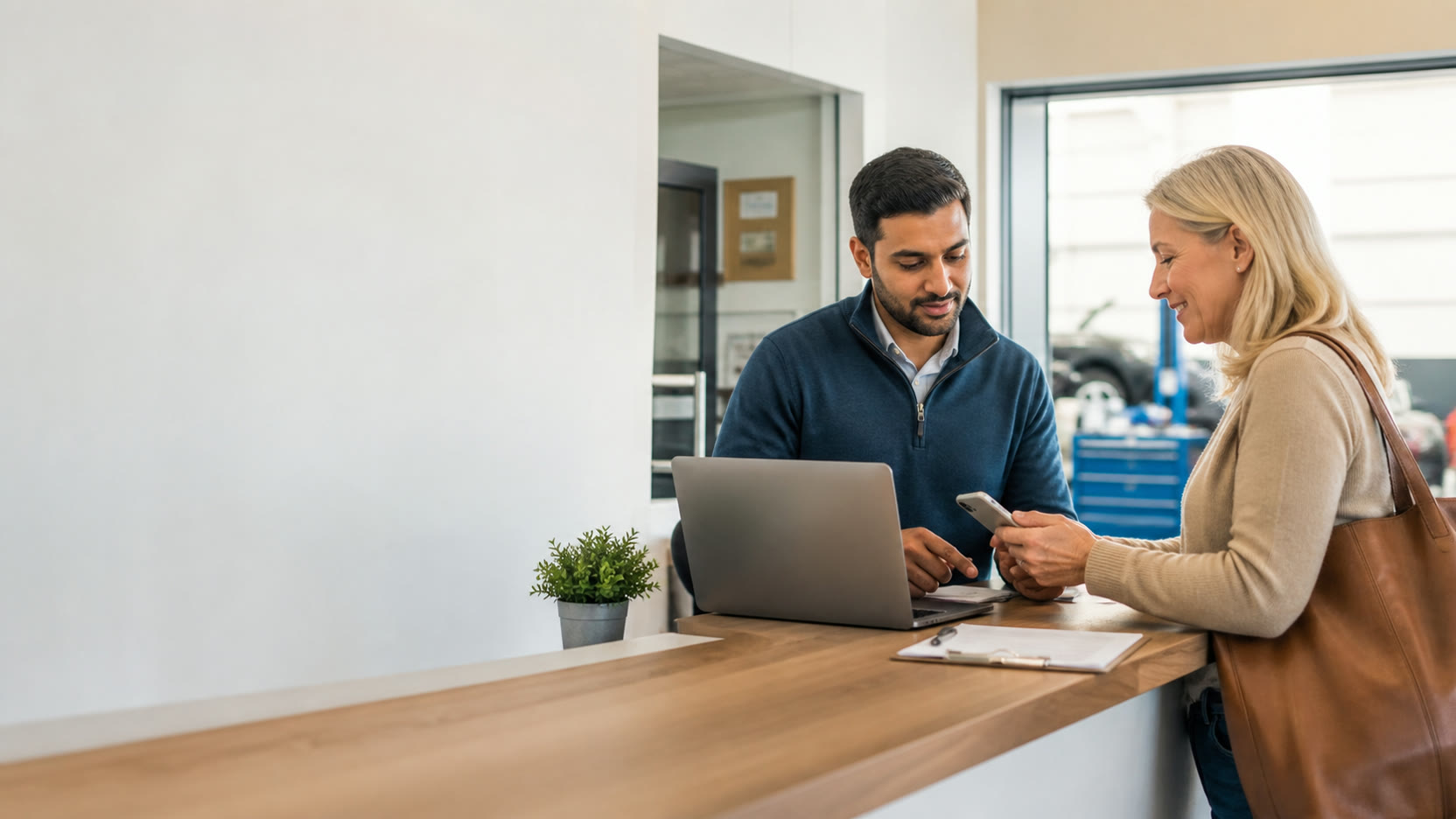 A customer completing an online payment while the service business checks the invoice.